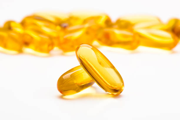 istock Close up of capsules Omega 3 on white background 1222960106