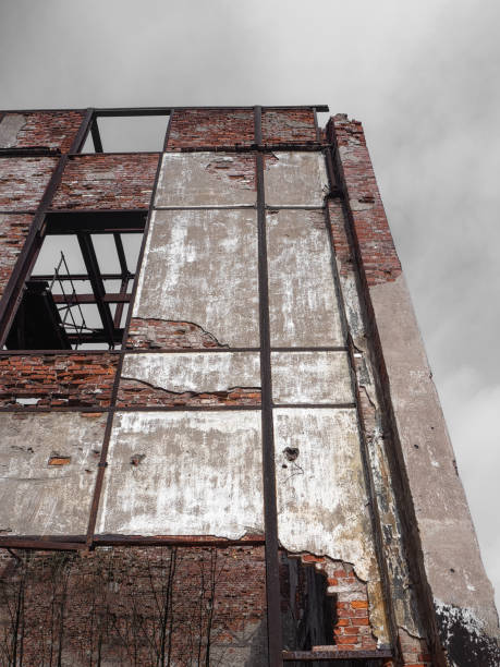 istock abandoned construction brick building with a wooden fence 1222961536