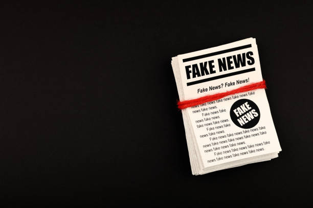 istock Stack of FAKE NEWS newspapers over black 1222961586