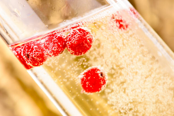istock red fruits in sparkling champagne 1222962495