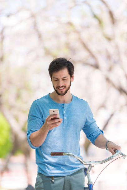istock Young Uruguayan man with his bicycle in Buenos Aires park 1222962868