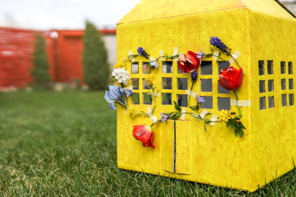 istock Beautiful yellow paper house 1222964389