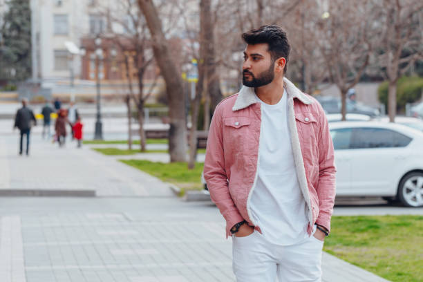 istock Stylishly dressed Indian bearded man walks down the street. 1222964999