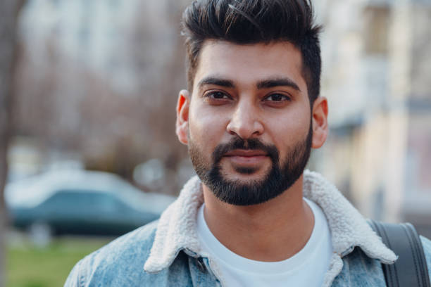 istock Stylishly dressed Indian bearded man walks down the street. 1222965022