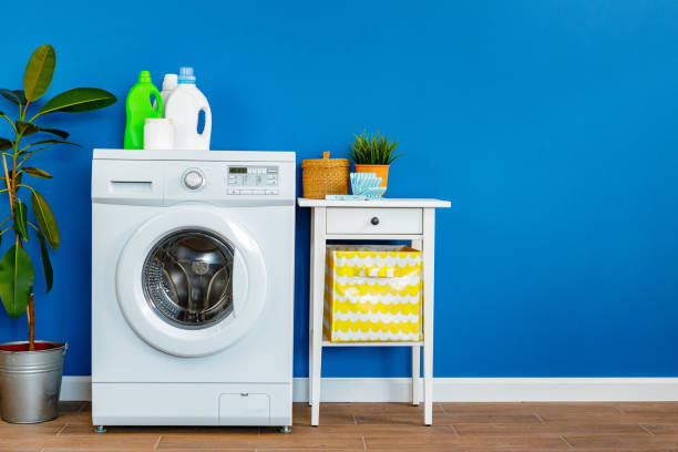 istock Bottle of detergent whith washing machine, indoors 1222965760