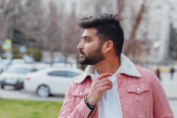 istock Stylishly dressed Indian bearded man walks down the street. 1222965860