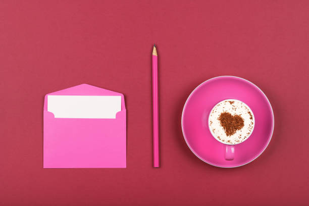 pink paper letter envelope and coffee cup - note rose image saturated color imagens e fotografias de stock