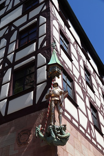 Medieval Nuremberg, Germany. 500 year old statue of Saint George the knight, slaying a dragon.
