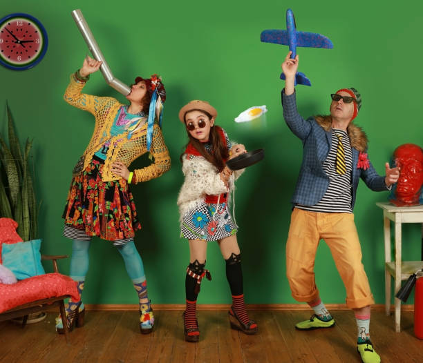 istock Freaks family having fun in the studio on a green background 1222972470