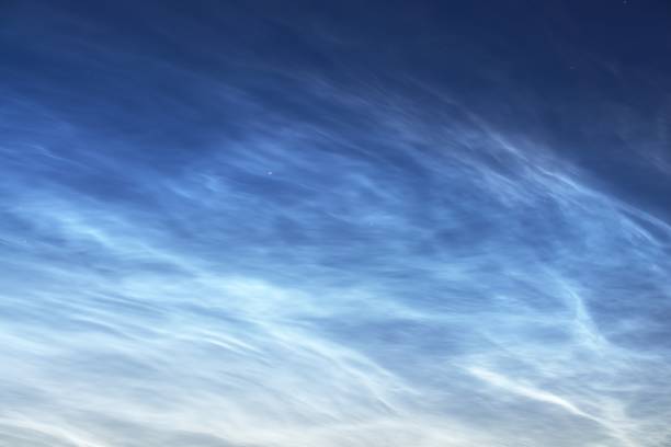 istock Starry sky with noctilucent clouds at summer solstice night in Finland. Beautiful flowing light. Fantastic cloudscape. Natural pattern. Abstract art. Finland 1222973680