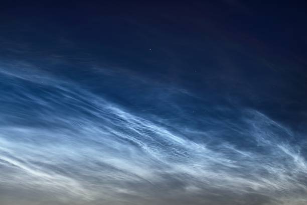 istock Starry sky with noctilucent clouds at summer solstice night in Finland. Beautiful flowing light. Fantastic cloudscape. Natural pattern. Abstract art. Finland 1222973685