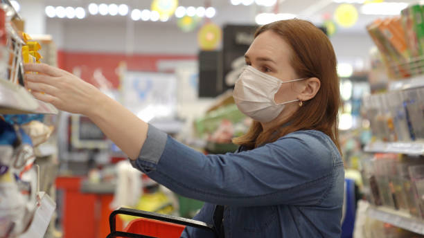 istock woman Buyer wearing a protective mask. 1222975426