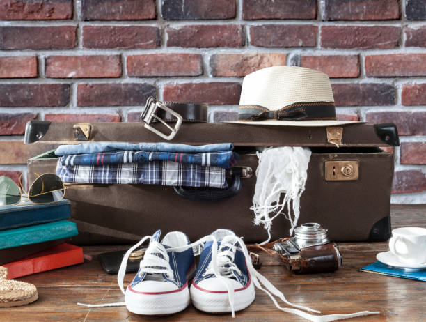 istock travel luggage with clothes 1222976334