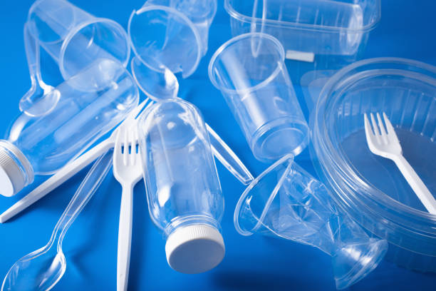 istock single use plastic bottles, cups, forks, spoons. concept of recycling plastic, plastic waste 1222976770