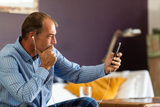 istock Businessman listening intently using phone for video call 1222976965