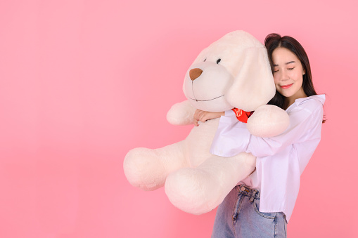 Beautiful girl hugging her Teddy Bear.