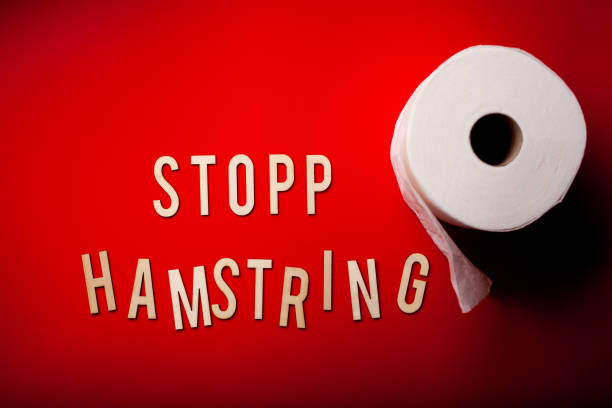 istock stopp hamstring norwegian word text wooden letter on red background coronavirus covid-19 1222981059