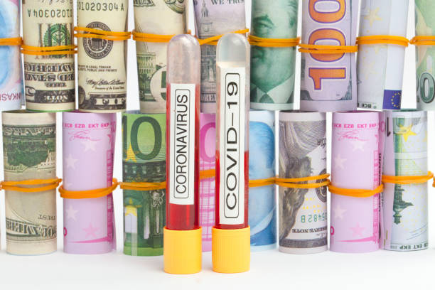 istock Coronavirus , COVID 19 test tubes and Rolled currency 1222981092