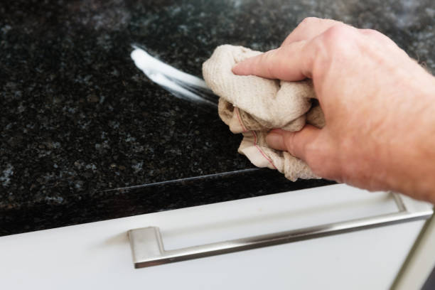 istock Man's hand cleaning surface in domestic kitchen 1222984566