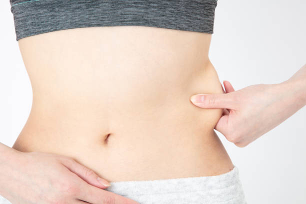 istock Diet image. Female belly and waist. 1222984772