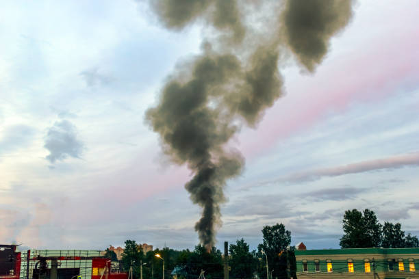 istock the building burns with fire and black smoke against the evening sky 1222985520