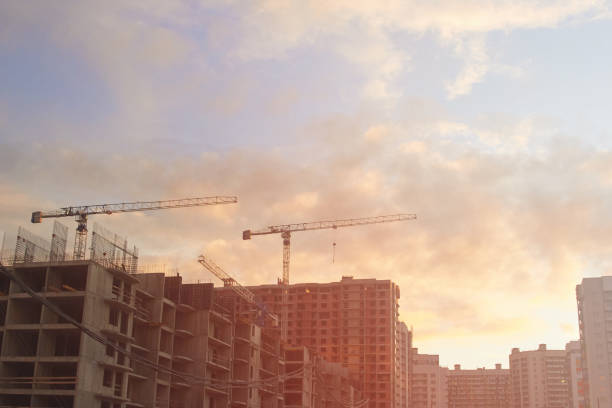 istock Industrial construction cranes the construction of an building 1222991178