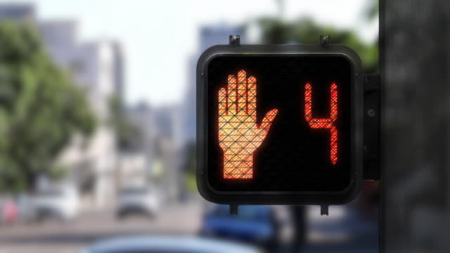 9 second red crosswalk countdown showing close up of walk signal