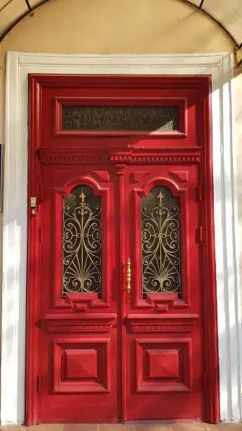 Photo of Entrance to ornate red door of historic building in European city Odessa of Ukraine