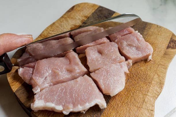 istock Cutting Pork for Kabobs Cooking at Home 1222992685