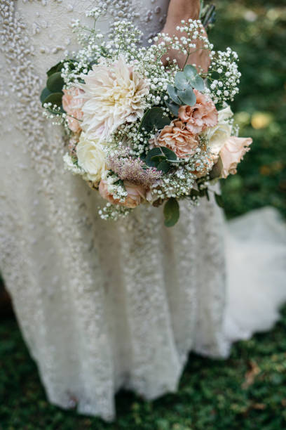 istock vintage bride holding bridal flowers 1222993448