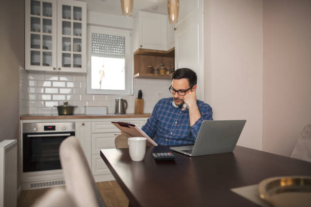 istock Businessman holding a notebook and reading. 1222993766