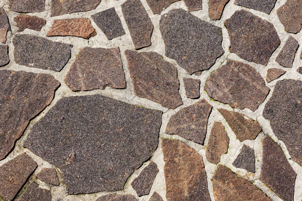 outdoor flooring made with irregular porphyry slabs - italy - stone textured italian culture textured effect imagens e fotografias de stock