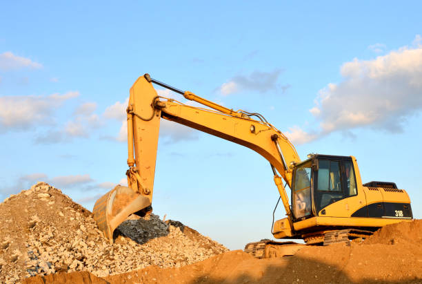 istock Excavator at construction site or mining quarry for crushing old concrete into gravel and subsequent cement production 1222996975