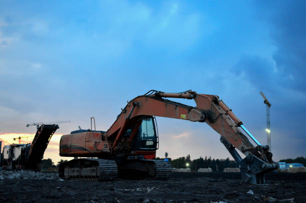 istock Excavator with crusher bucket for crushing concrete. Construction waste recycling for construction mix. 1222997035