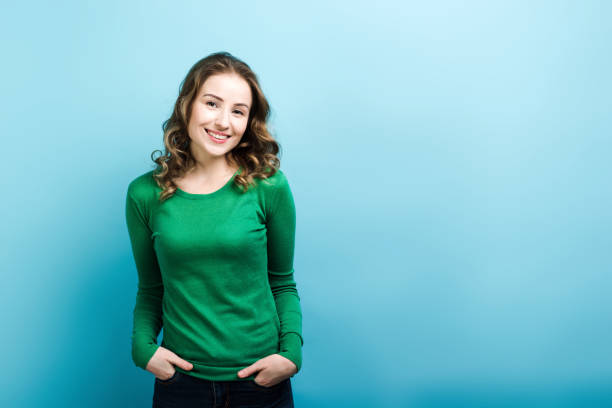 istock Smiling girl posing in green sweater. 1222998374