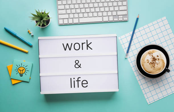 Work and life concepts with text on light box on desk table in home office.positive emotion to success