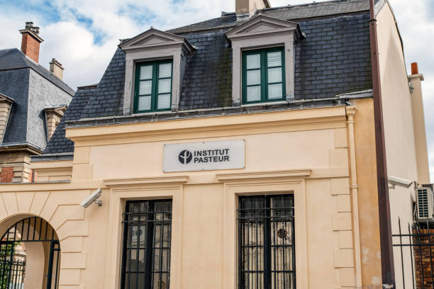 Entrance of Old building of the Pasteur institute in Paris Paris, France - March 11 2020: Entrance of Old building facade of the Pasteur institute in Paris pasteur institute stock pictures, royalty-free photos & images