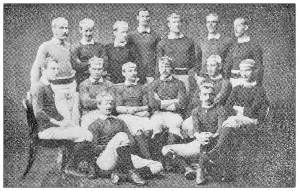 Antique black and white photograph of sport, athletes and leisure activities in the 19th century 1885 Antique black and white photograph of sport, athletes and leisure activities in the 19th century: 1885 rugby team stock illustrations