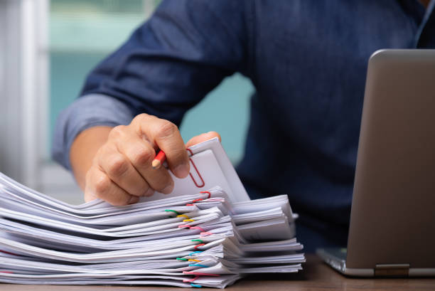 istock Man hand with pen Picking document For working from home, concept of social distancing coronavirus covid-19. 1223001415
