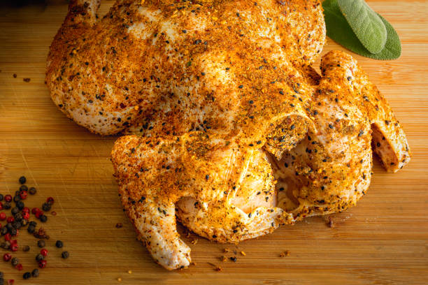 istock Whole raw chicken rubbed with spices, ready for bbq 1223001473