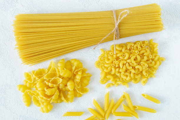 istock Dry several types of pasta on a light background 1223001493