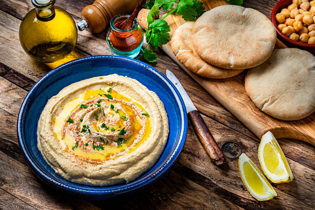 istock Vegan food: hummus in a plate with pita bread. High angle view 1223001503