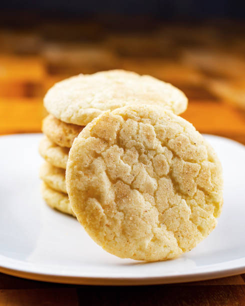 istock A stack of snickerdoodle cookies on a wooden board sitting on a wooden table. 1223001570