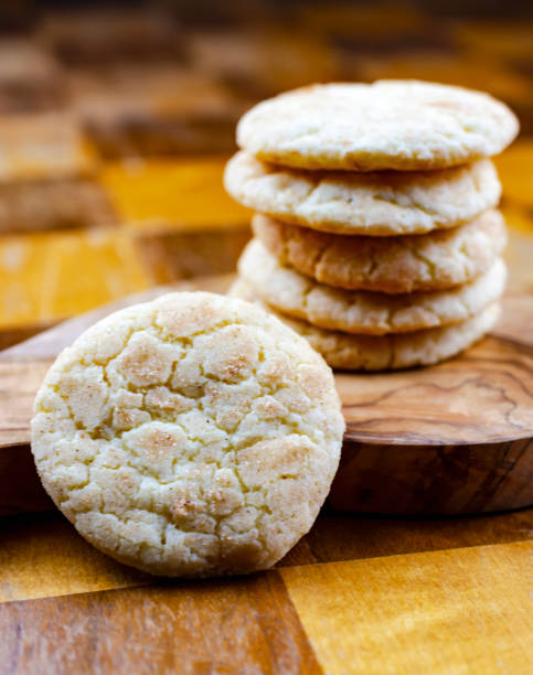 istock A stack of snickerdoodle cookies on a wooden board sitting on a wooden table. 1223001574