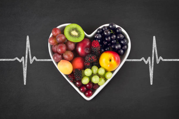 istock Fruits in Heart Shaped Bowl on Blackboard 1223001640