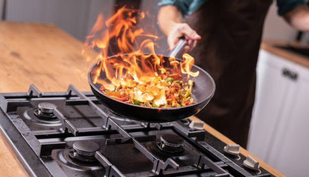 istock Professional Chef Tossing Food 1223002100