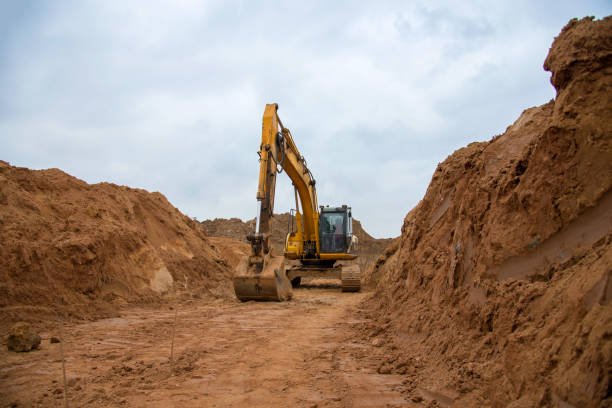 istock Excavator digs a large trench for pipe laying 1223002462