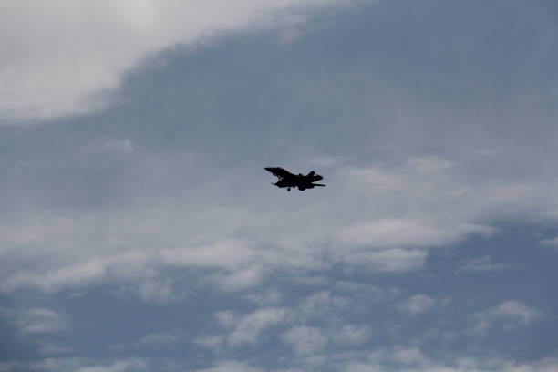 istock military jet in flight against a blue sky 1223002505