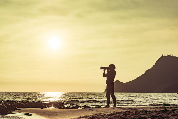 istock Woman with camera on Monsul beach, Spain 1223003258