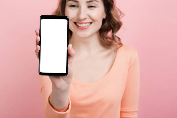 istock White empty blank mockup vertical screen in the female hand closeup 1223003521